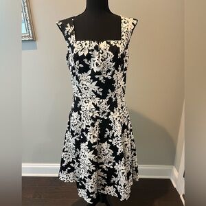 White House Black Market size 8 tea length black and off white floral dress.
